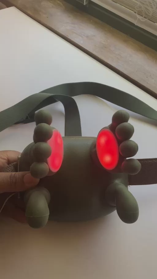 Massager shown in motion and visible heat sensors on